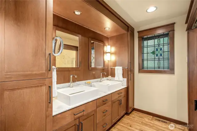 Elegant Primary Bath wash area with abundant built-in storage…
