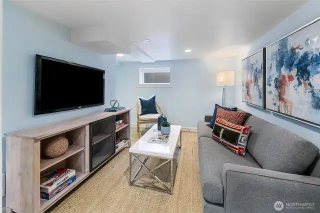 The finished lower level is ideal for guests with a separate exterior entrance and 3/4 bathroom!