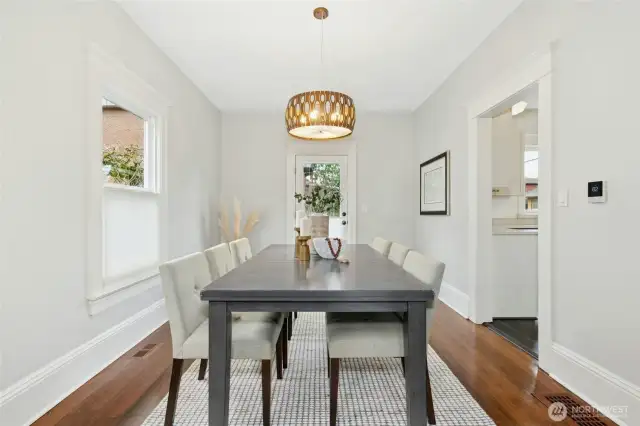 The dining room that leads to the kitchen and the backyard.