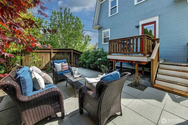 The backyard showing the door which leads to the dining room.