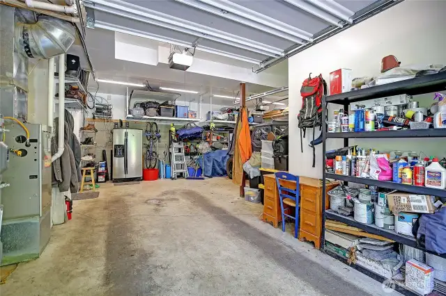 Large two car attached garage houses the furnace and newly installed hot water heater.