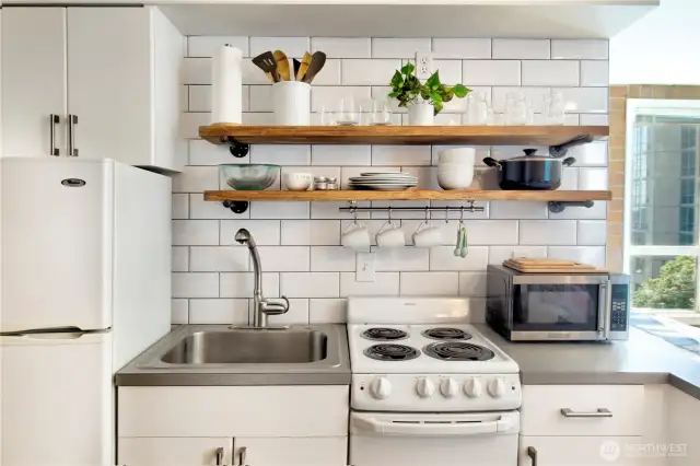Oversized brick, open shelving matches the interior styling