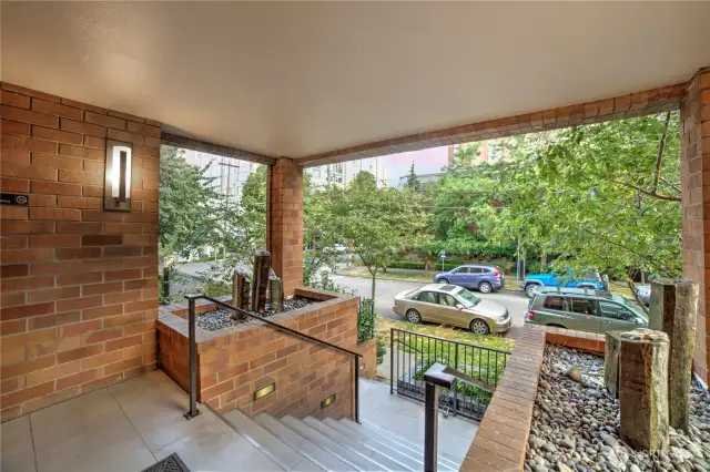 Thoughtfully designed entrance surrounded by mature greenery