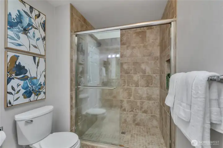 primary bath-walk in tiled shower and toilet