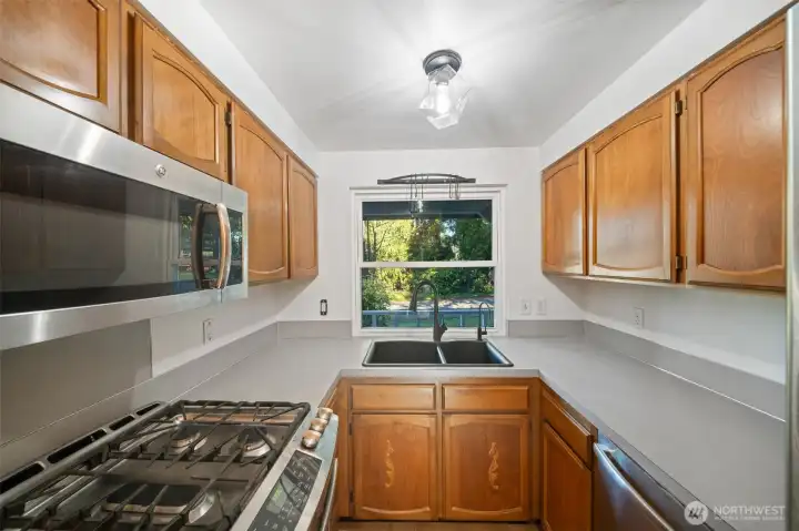 Lots of counter and cabinet space, newer appliance, lighting, sink and fixtures. Views to the front of the house