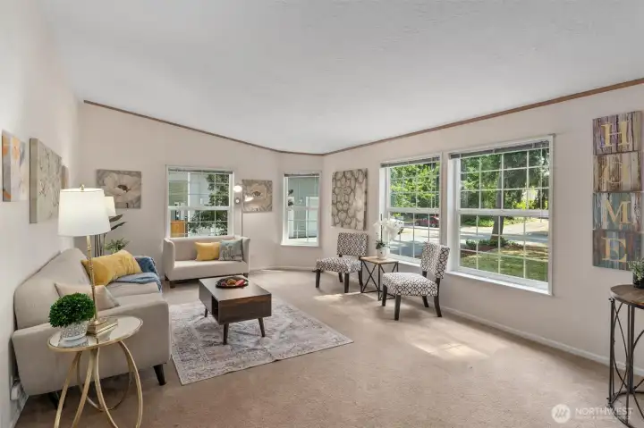 Living room with lots of windows to let in natural light