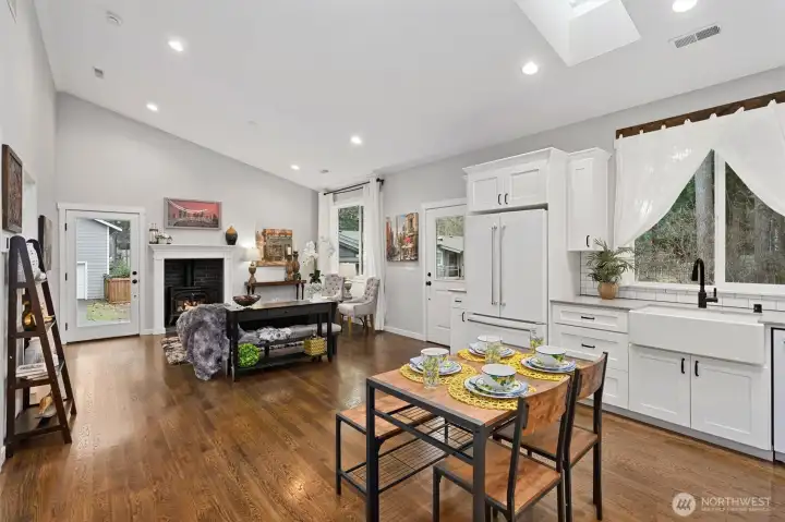 ADU kitchen opens to family room with gas fireplace