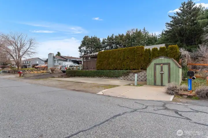 Storage shed conveys. RV Spot with power and sewer dump