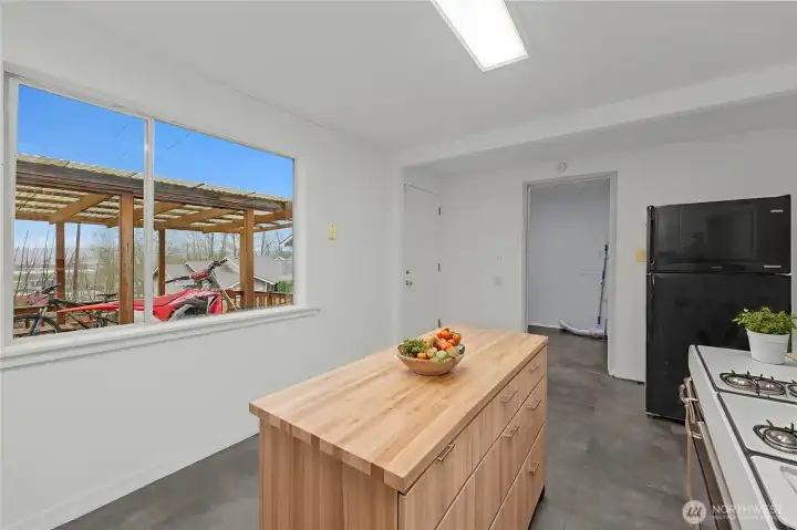 Kitchen - Virtually staged - Looking towards laundry room