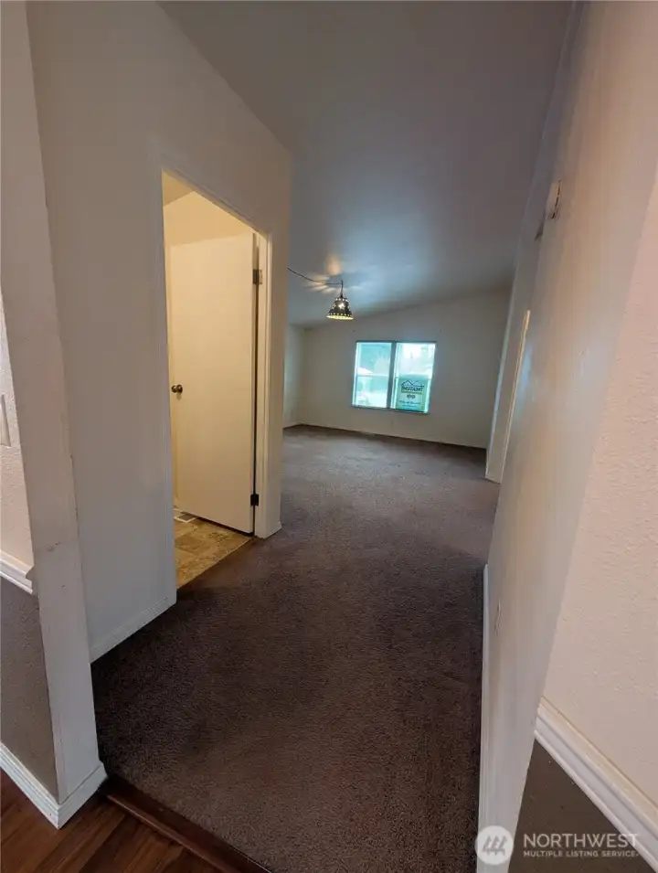 From living/dining room. Bathroom on the left, 2nd living room straight ahead and 2 bedrooms on the right.
