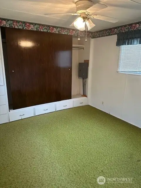 Down the hall is the main bedroom with a large wall length closet.