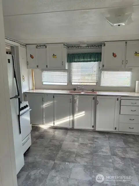 The single wide home has a spacious and light kitchen.