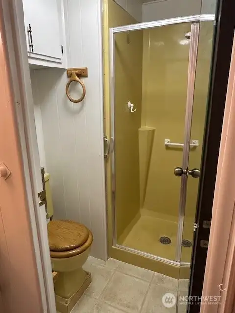 A separate closed off area  for the shower and toilet area.