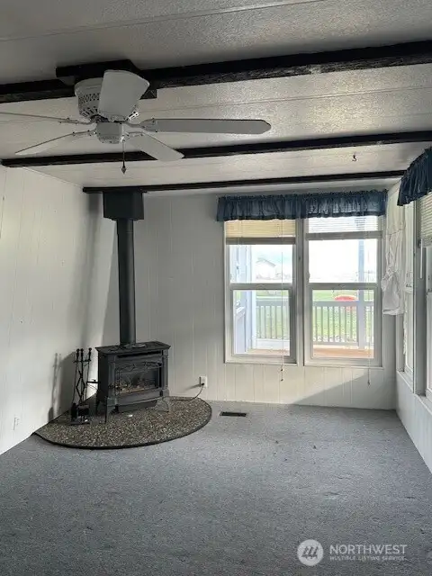The living room leads out to the huge covered deck with a view to the sound.