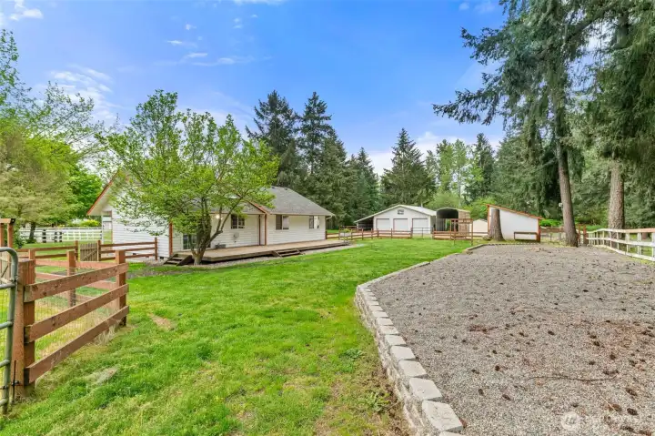 Fenced back yard and pea gravel fire pit area