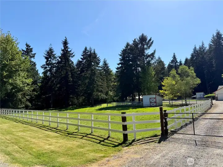 Front pasture with livestock shelter. Freshly painted fence