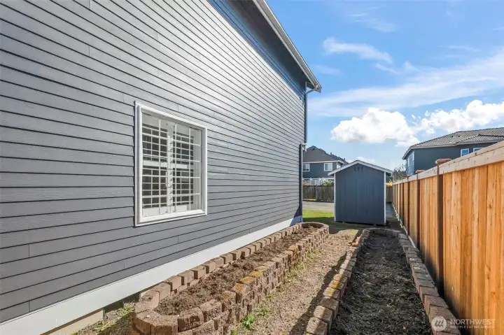 Garden space with drip irrigation and storage shed