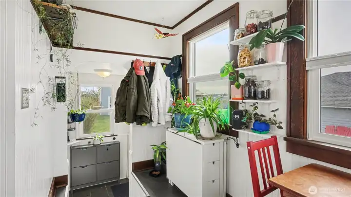 Kitchen nook offers storage and back door leads to the backyard.
