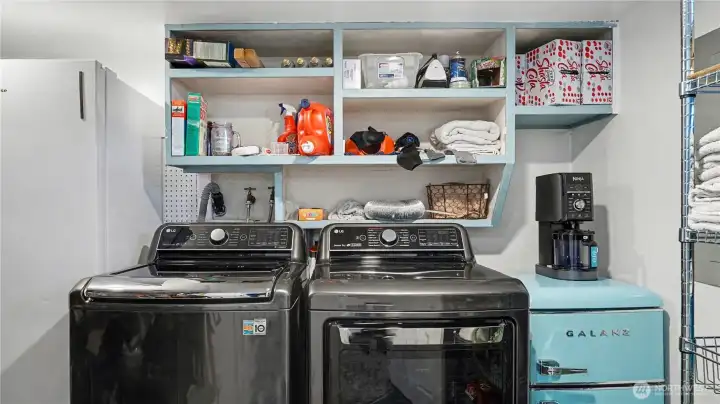 Spacious laundry with plenty of storage.