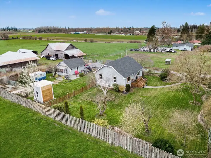 Outside, the property truly shines with fruit trees, a patio, a large grassy lawn, and plenty of space to relax or play.