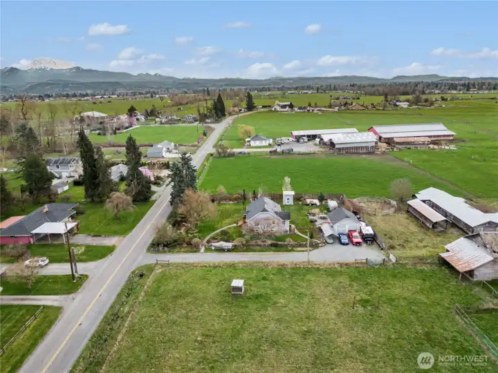 Property is nestled between larger lots in peaceful environment, complete with Mt. Rainier views.