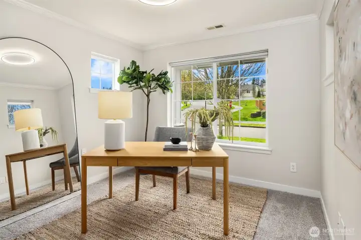 Main level bedroom that is also a great office.