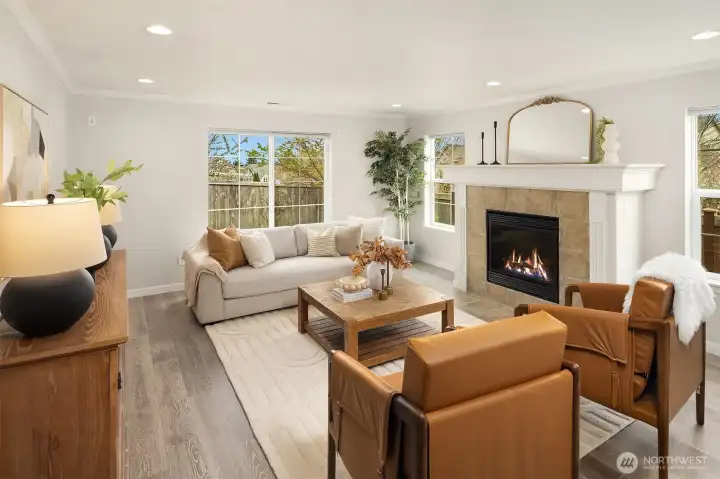 Main level living room with a cozy gas fireplace.