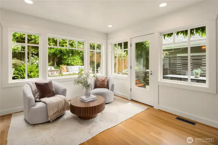 Architect owners expanded and added this area for a spot connected to nature where natural light streams through and gatherings can expand from the dining area and into the patio and yard. Architect owners expanded and added this area for a spot connected to nature where natural light streams through and gatherings can expand from the dining area and into the patio and yard.