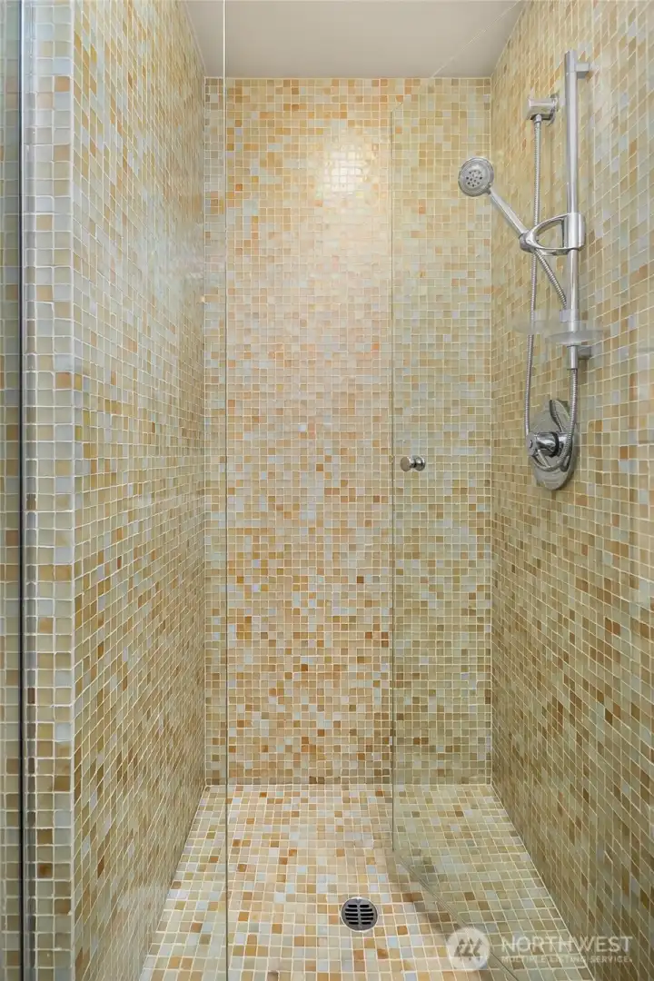 Beautiful custom shower on the main level. Beautiful custom shower on the main level.