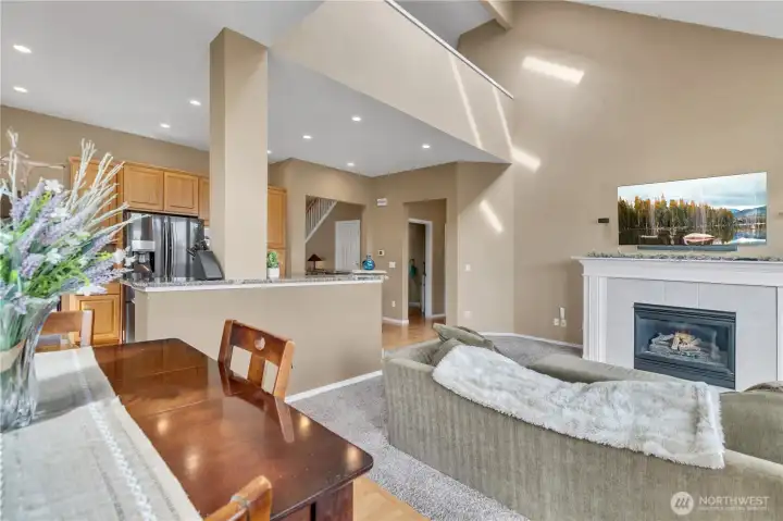 Soaring vaulted ceilings and gas fireplace in the family room