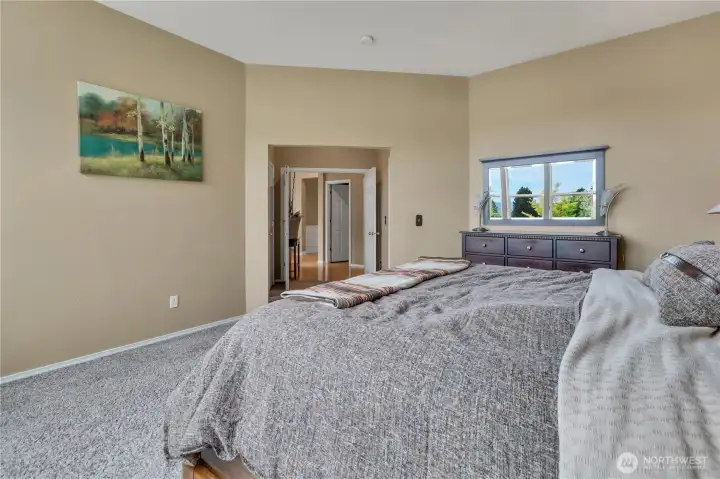 Elegant primary suite with french door entry, walk-in closet, and 5-piece bath.