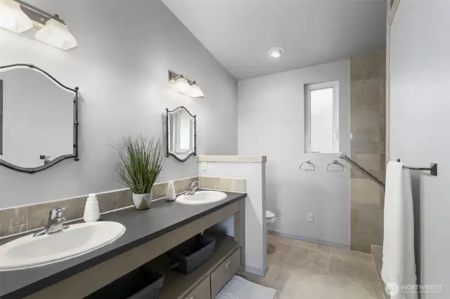 Primary bathroom with fully tiled shower