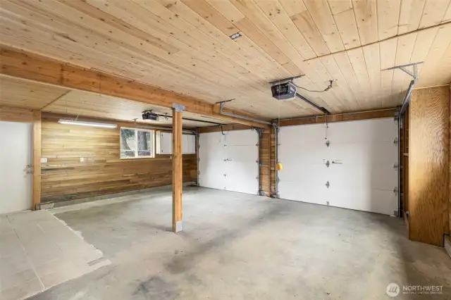 Two-car garage and access to the backyard and greenhouse - come see!