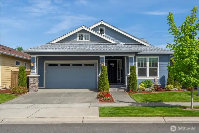Perched on an elevated lot with the desired aspect of morning sun streaming in the rear of the home and lovely shade in the afternoons. This popular "Refresh" plan offers stellar & high-end upgrades beginning with the front tiled porch. Stone accents, convenient garage overhang and mature landscaping.