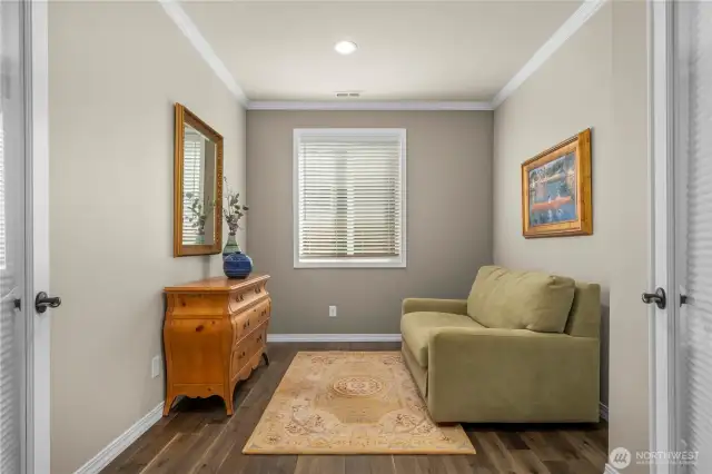 Den with French doors, crown molding and Engineered hardwoods.  The French doors have blinds so this room can also be used as a 3rd bedroom.