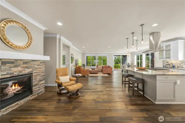 Custom tiled fireplace, generous spaces, crown molding and the gorgeous Engineered hardwoods.