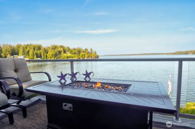 unparalleled deck views stretch across calm waters and forested shoreline-pure PNW tranquility at its finest