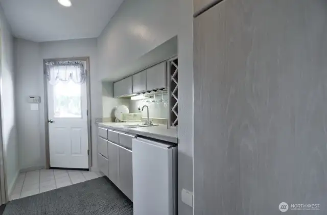 downstairs wet bar with wine storage, mini fridge and private entry-perfect for entertaining or guest convenience