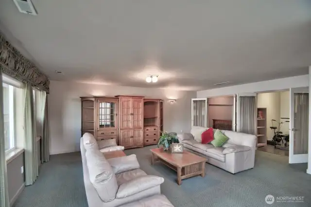 spacious lower level with cozy flex rooms -ideal for guest sleeping , home gym or creative space