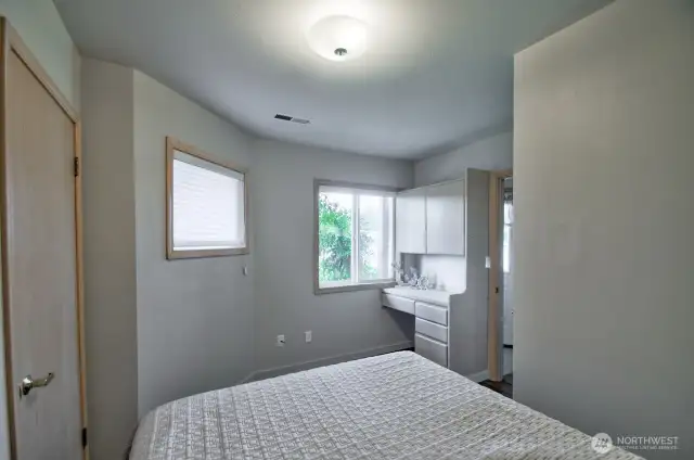 bright lower level bedroom with large windows, private wet bar just outside room- ideal for guests or multi -generational living