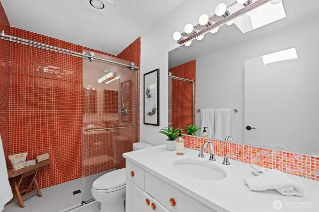 Tiled primary bath.