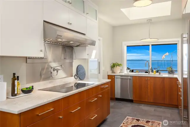 New induction cook-top with mounted pasta/ soup faucet. WOLF venting and dreamy views.