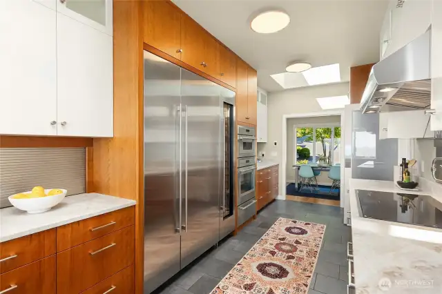 The updated kitchen features a spacious appliance garage, Sub-Zero refrigerators and wine storage. Wall ovens, an abundance of work counters and storage galore!