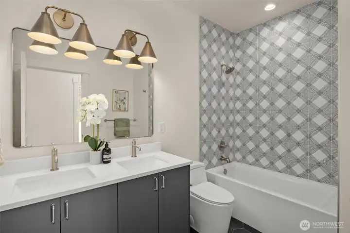 Full bath with quartz vanity.