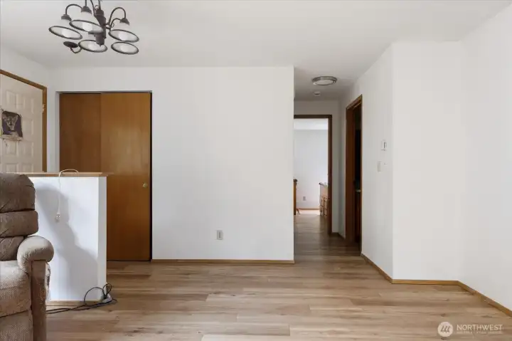 Entrance to home, view of Living Room and hallway that leads to full bath, Primary Bedroom and 2 more bedrooms