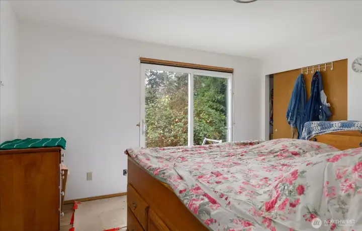Primary Bedroom has newly installed sliding door.