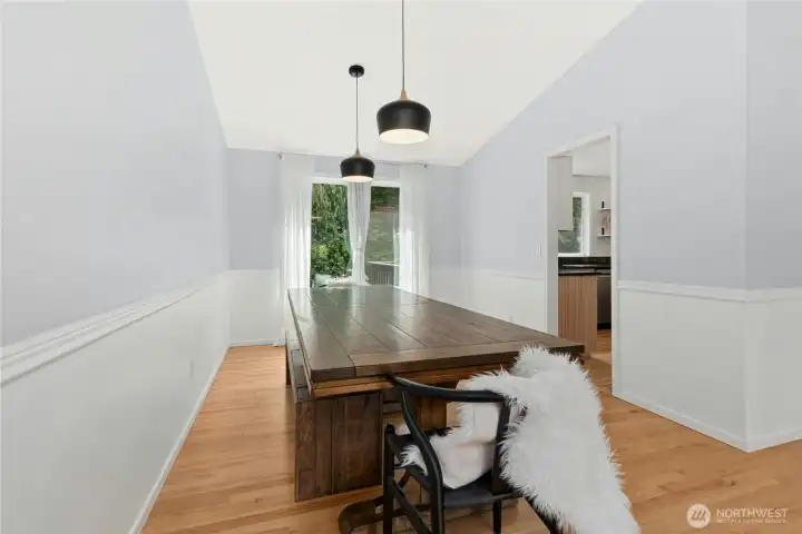 Open-concept flow between living and dining rooms