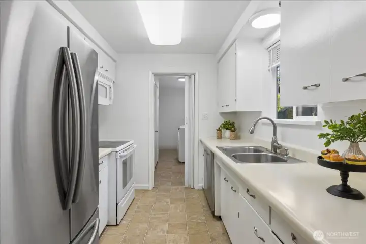Kitchen has double door fridge.