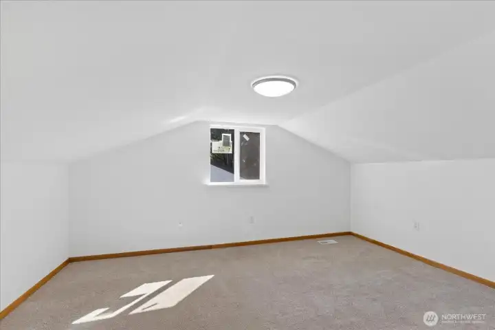upstairs is a large bedroom which offers so many options.  Fresh paint and new carpet.