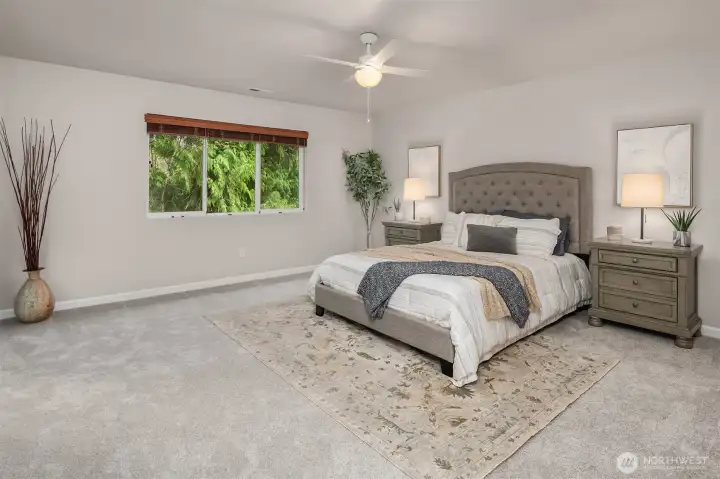 Spacious Primary Suite overlooking the scenic backyard. New paint and carpet.
